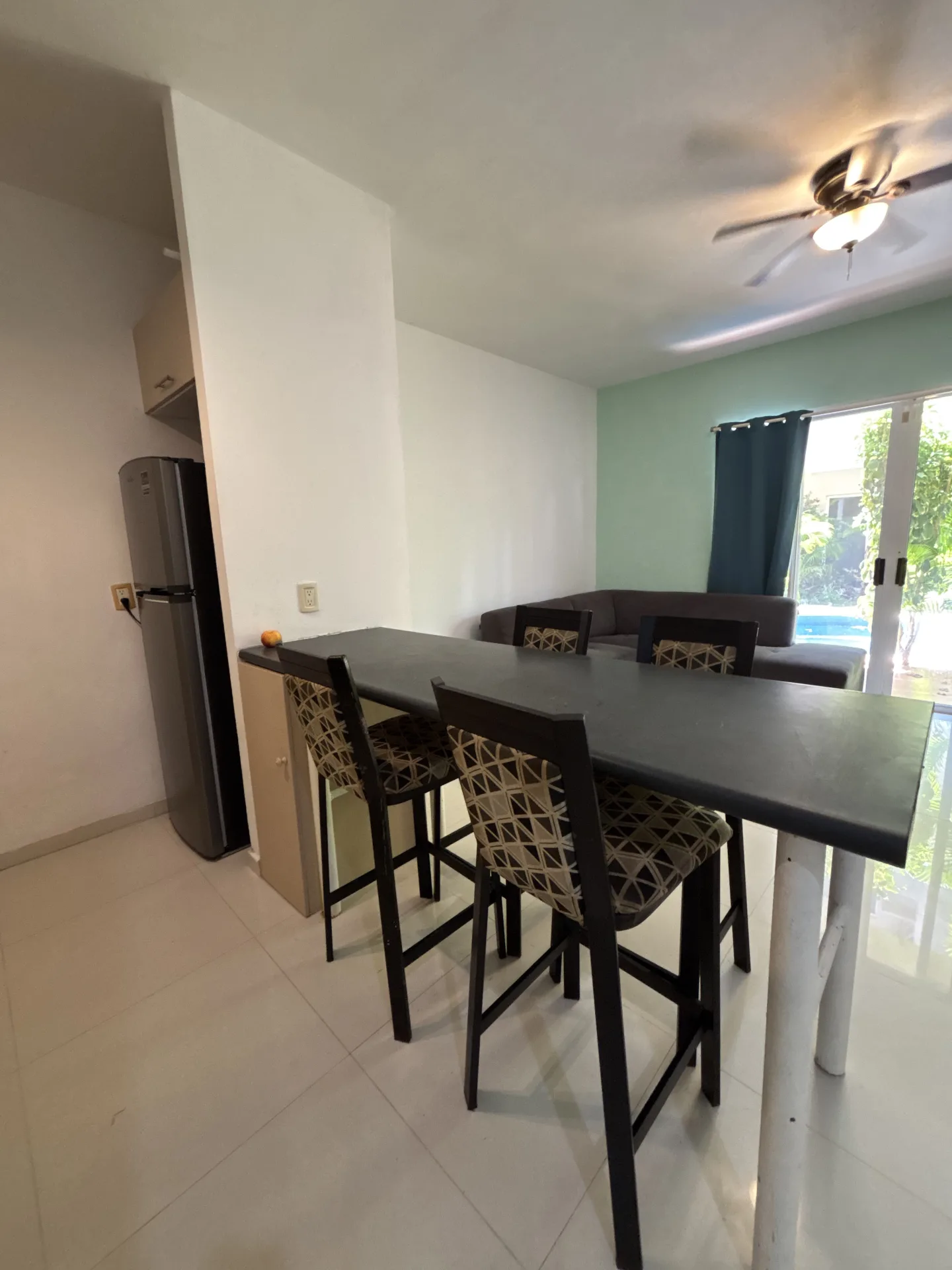 Breakfast bar and living area – 2-bedroom condo in Playacar Phase 2