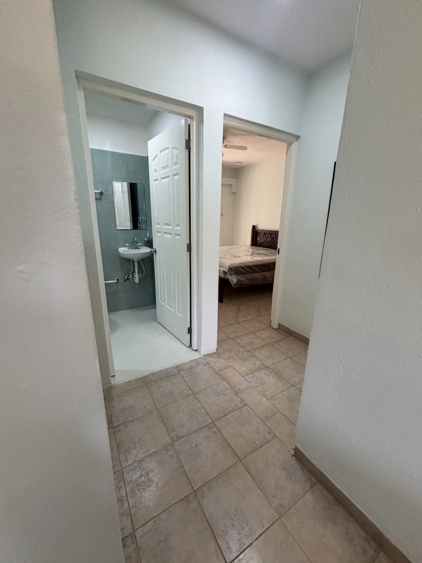 Hallway to the bathroom and bedroom – 2-bedroom condo for rent in Playacar Phase 2