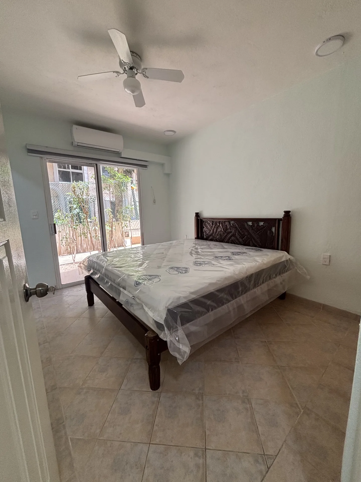 Primary bedroom with terrace door – 2-bedroom condo for rent in Playacar Phase 2