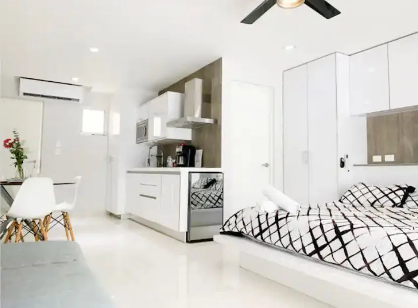 Open-plan living area and kitchen – 1-bedroom condo in Playa del Carmen
