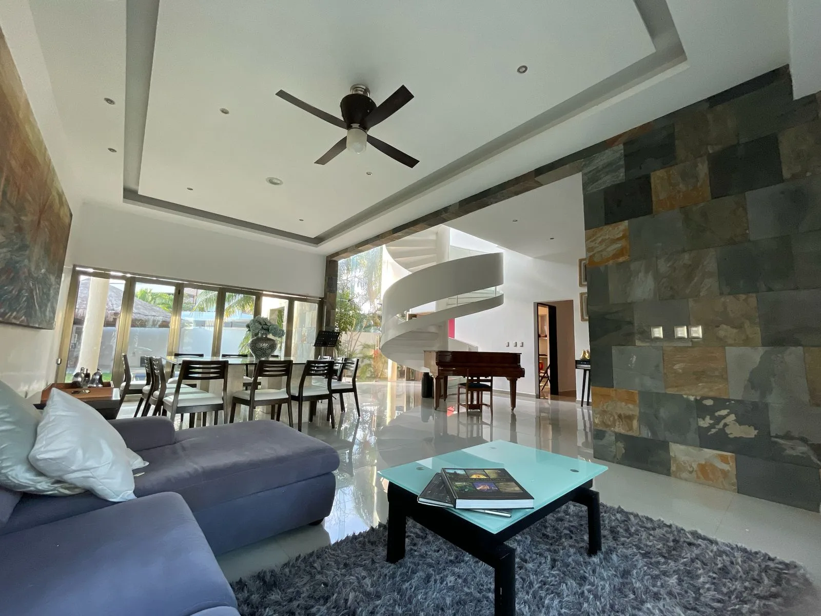 Living room with stone accent wall – 5-bedroom house in Villa Magna, Cancun