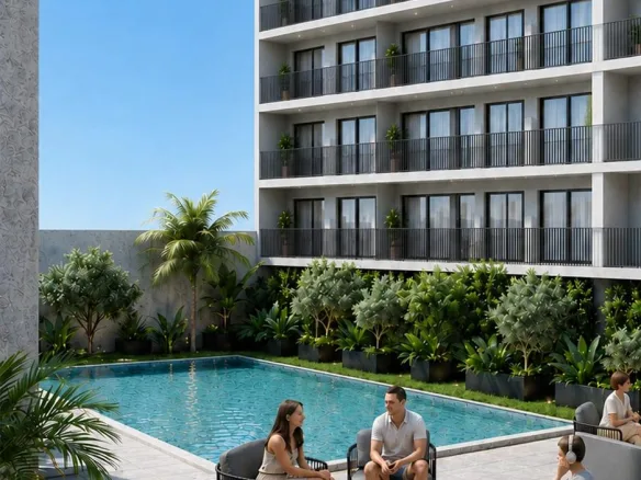 Render de la alberca y el edificio – estudio en preventa en Playa del Carmen
