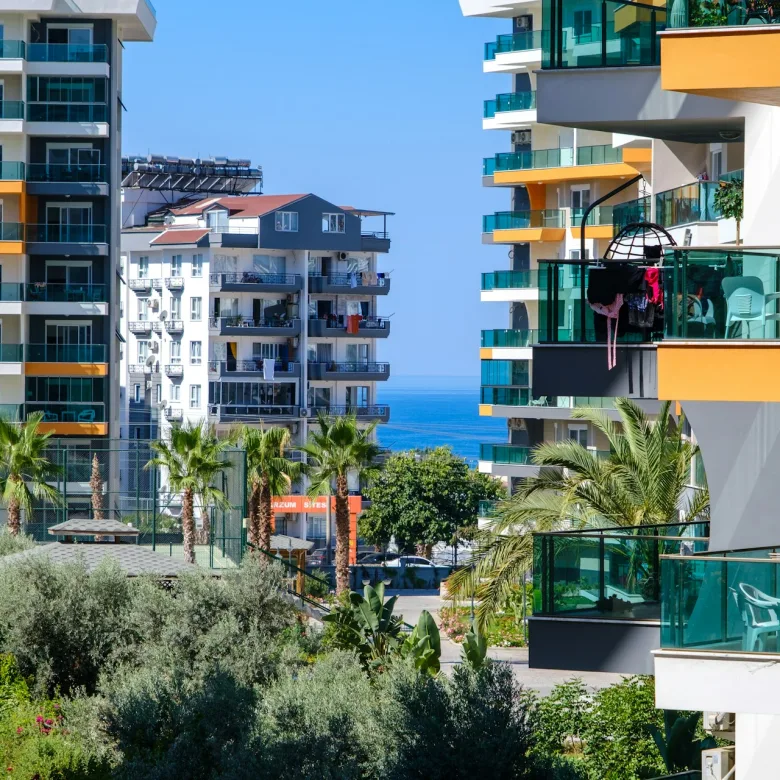 Modern condo buildings with palm trees