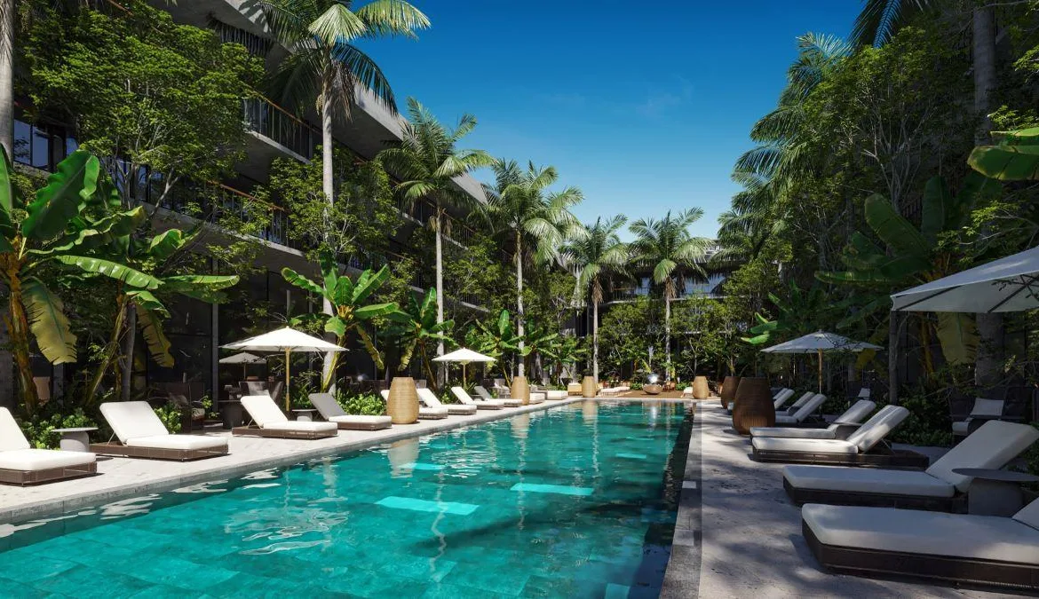 Departamento garden de 2 recámaras con doble altura en venta en Playa del Carmen