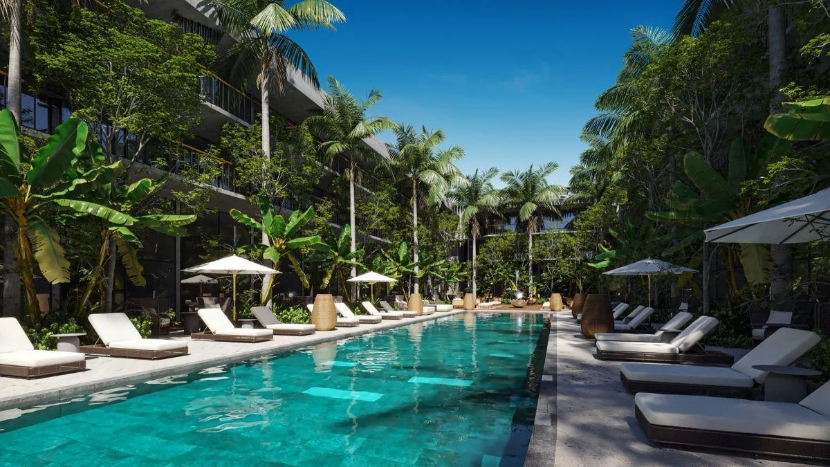 Departamento garden de 2 recámaras con doble altura en venta en Playa del Carmen