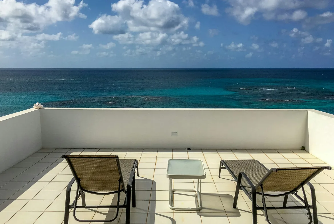 Terrace with sun loungers overlooking the Caribbean Sea